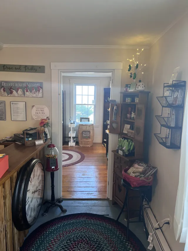 Inside the shop looking down the hall past the counter