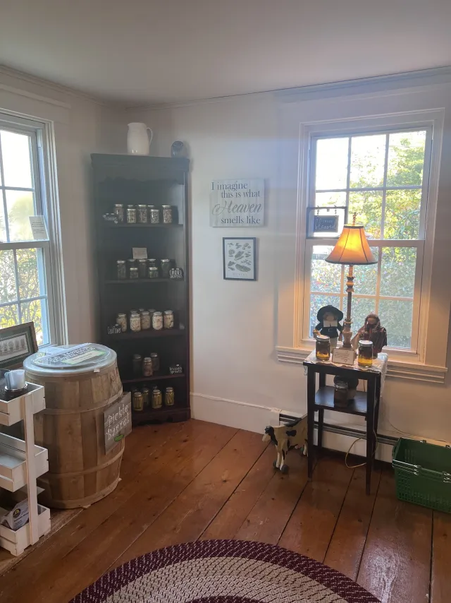 Sunny shop corner with shelves of jars and a lamp